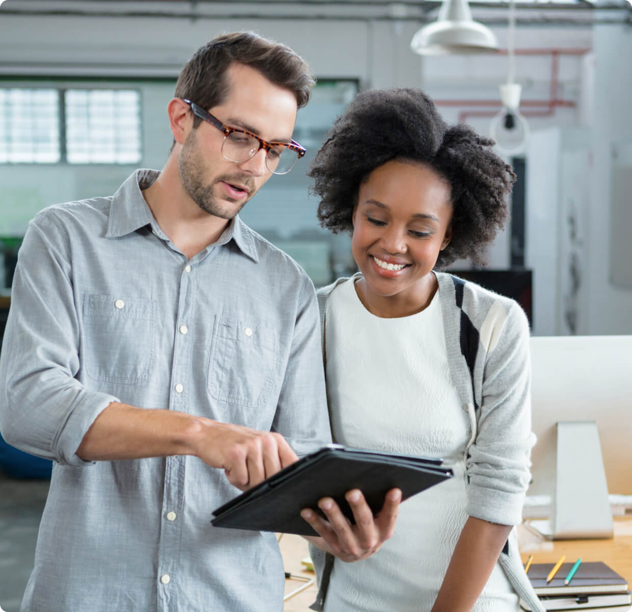 A user presenting Jig to colleague using a tablet device.