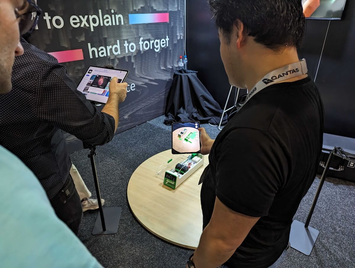 Visitors to the JigSpace booth at the SXSW Sydney Exhibition Breakthrough Zone