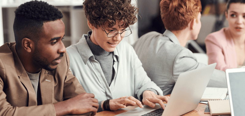 People training using a laptop.