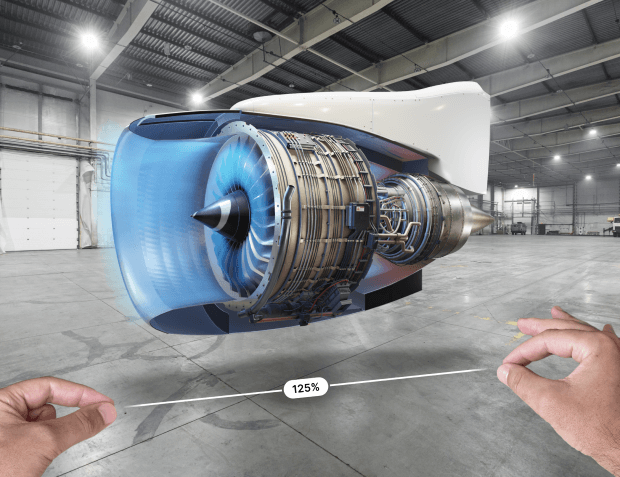 A jet engine in augmented reality on JigSpace for apple vision pro being resized by two hands